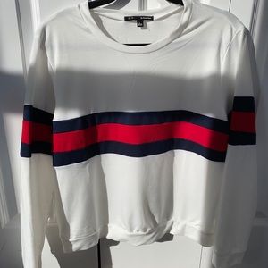 White sweater with red and blue stripes
